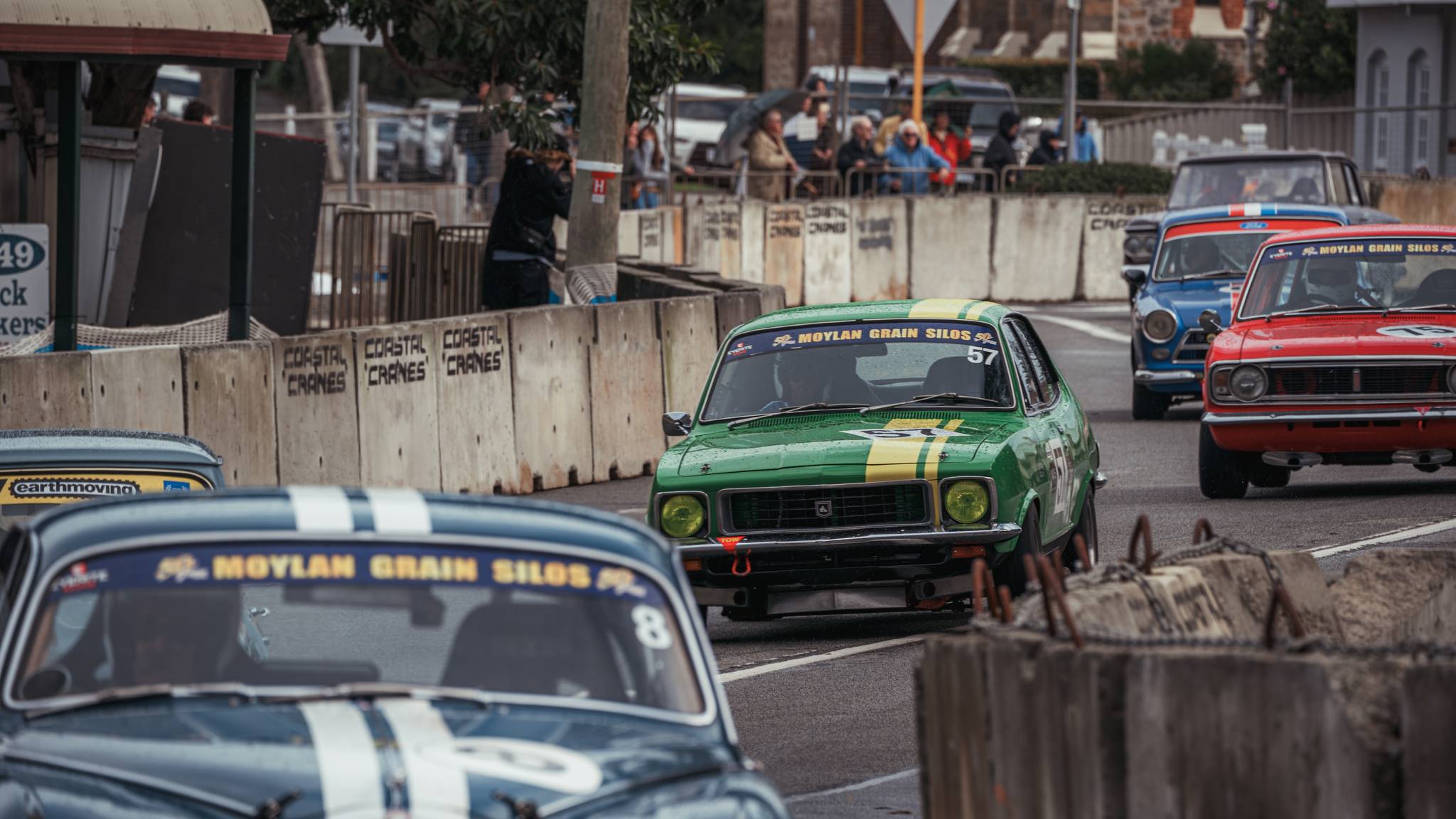 Vintage race cars on a road