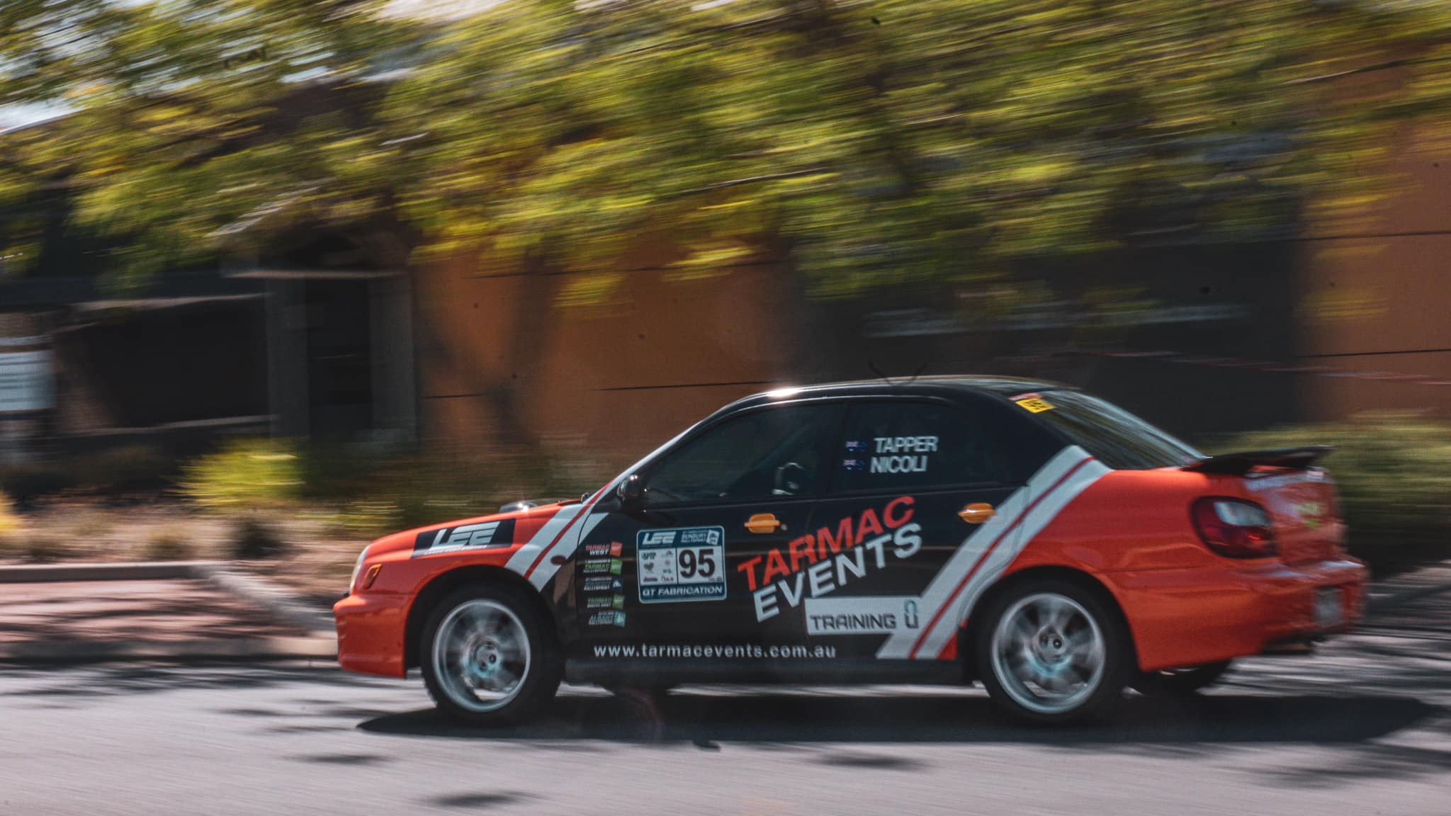 A racecar racing down a track